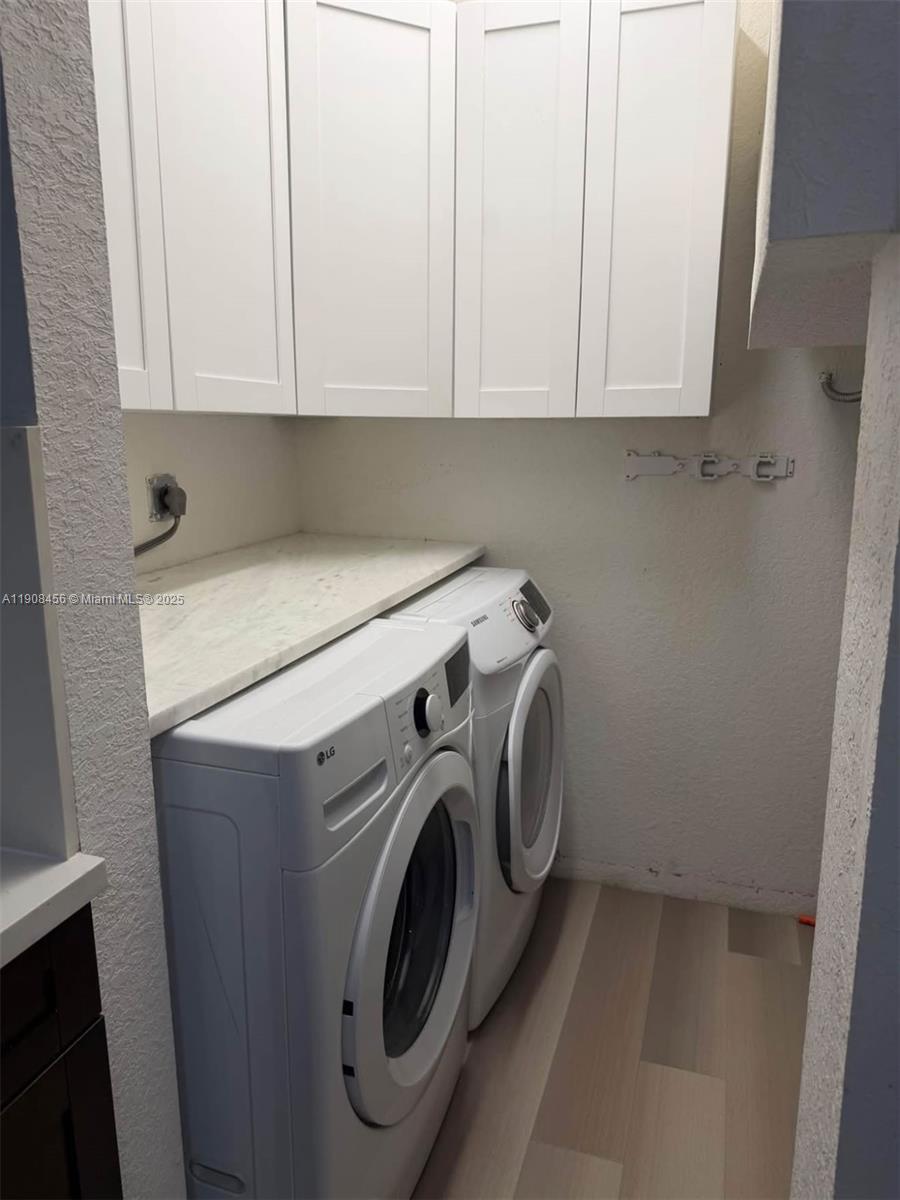 965 Southwest 153rd Path Miami, FL 33194 - Photo 10 of 27 a utility room with dryer and washer
