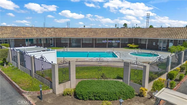 a view of a house with a backyard and a patio