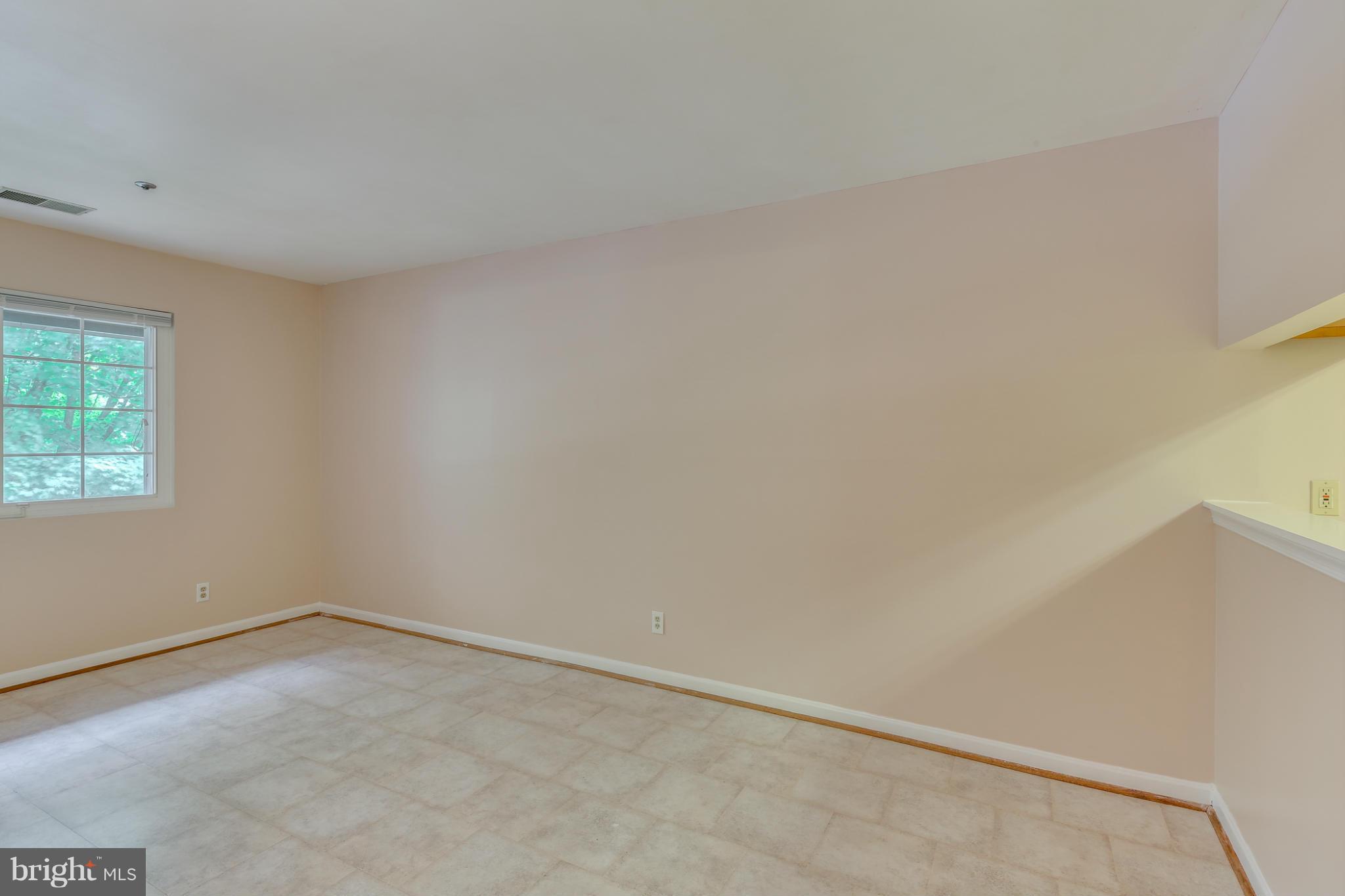 4906 Columbia Road, Unit 7 Columbia, MD 21044 - Photo 14 of 26 an empty room with a window