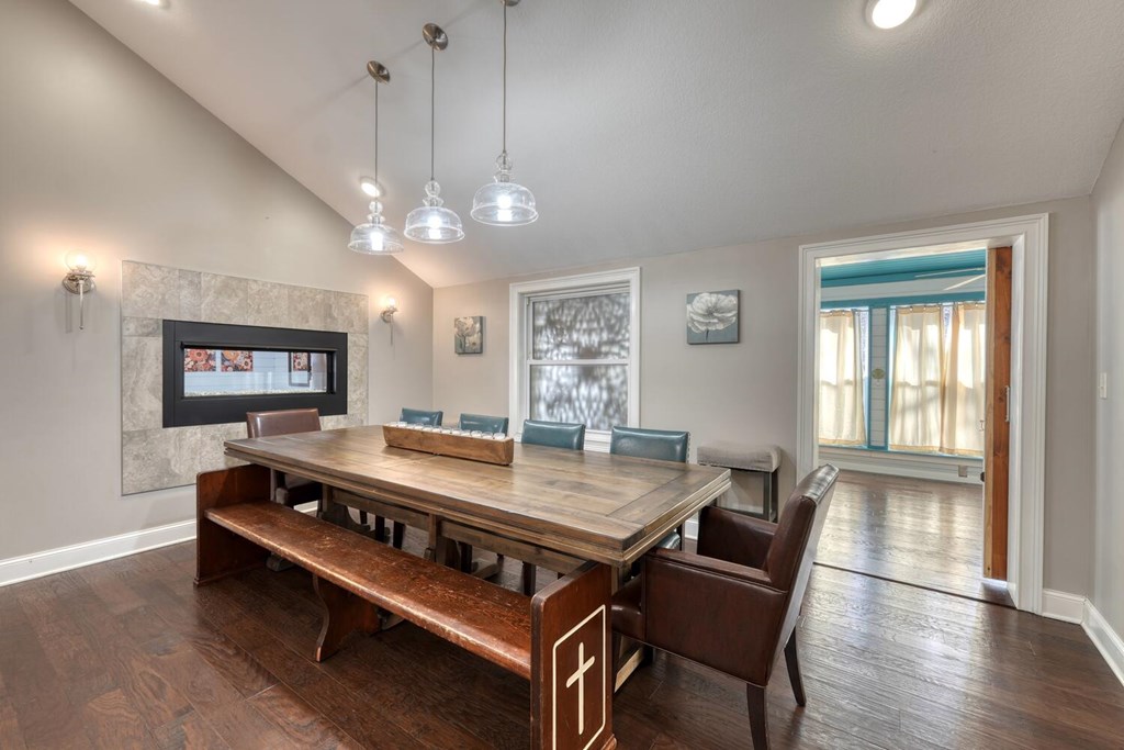 3035 Skeenah Gap Road Suches, GA 30572 - Photo 14 of 33 a dining room with wooden floor a chandelier a wooden table and chairs