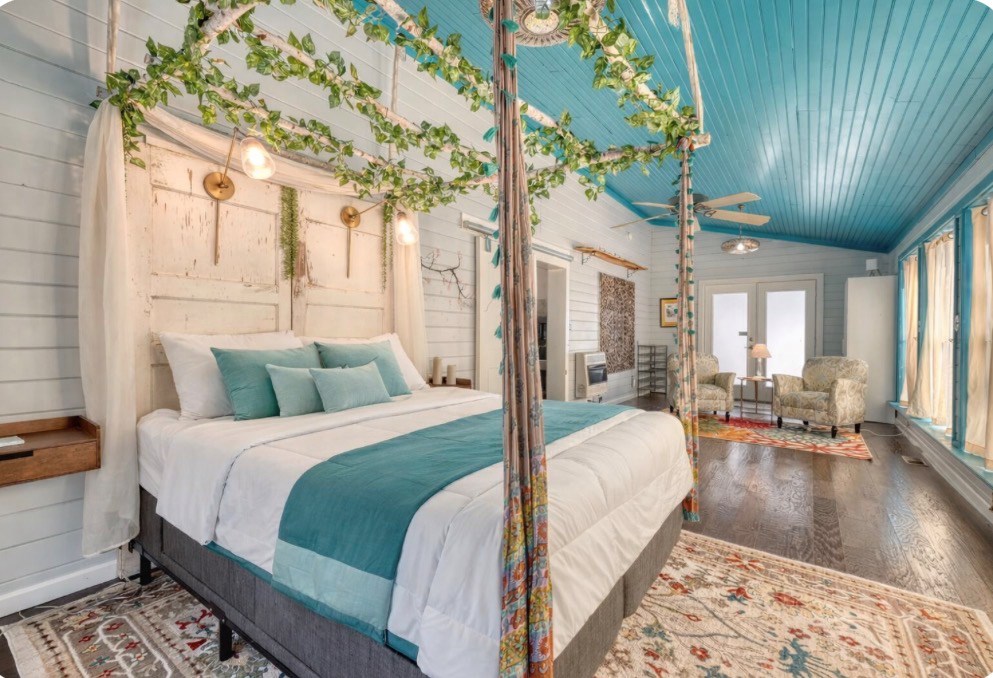 3035 Skeenah Gap Road Suches, GA 30572 - Photo 22 of 33 a large bedroom with bed and large windows