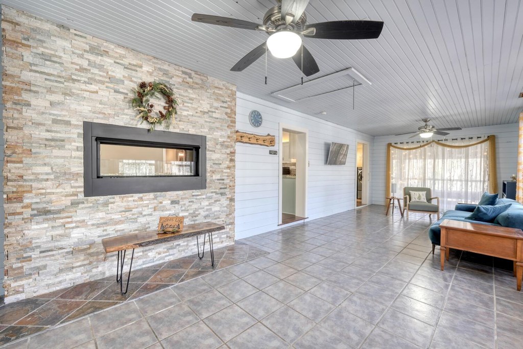 3035 Skeenah Gap Road Suches, GA 30572 - Photo 6 of 33 a living room with couches and a flat screen tv