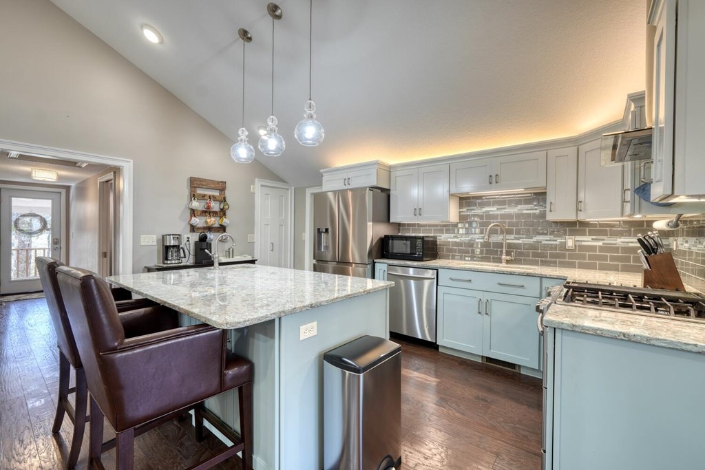 3035 Skeenah Gap Road Suches, GA 30572 - Photo 9 of 33 a kitchen with a dining table chairs sink and cabinets