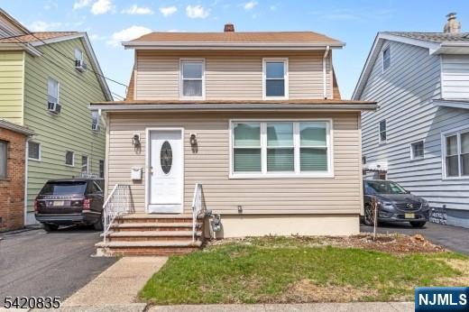 39 Hurden Street Hillside, NJ 07205 - Photo 1 of 20 a front view of a house with a yard