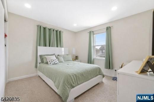 39 Hurden Street Hillside, NJ 07205 - Photo 13 of 20 a bedroom with a bed and a window