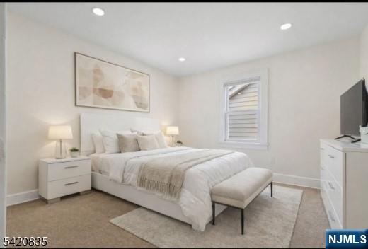 39 Hurden Street Hillside, NJ 07205 - Photo 14 of 20 a bedroom with a bed and a flat screen tv