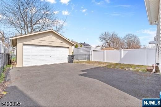 39 Hurden Street Hillside, NJ 07205 - Photo 20 of 20 a view of a house with a yard and garage