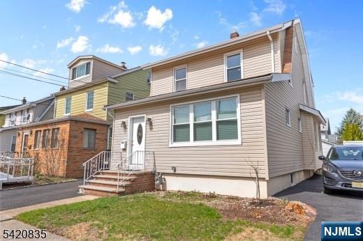 39 Hurden Street Hillside, NJ 07205 - Photo 2 of 20 a front view of a house with a yard