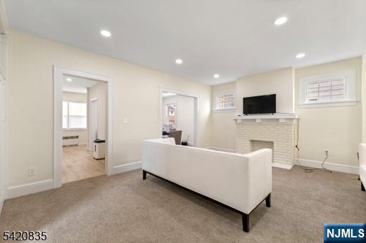 39 Hurden Street Hillside, NJ 07205 - Photo 4 of 20 a living room with furniture and a flat screen tv