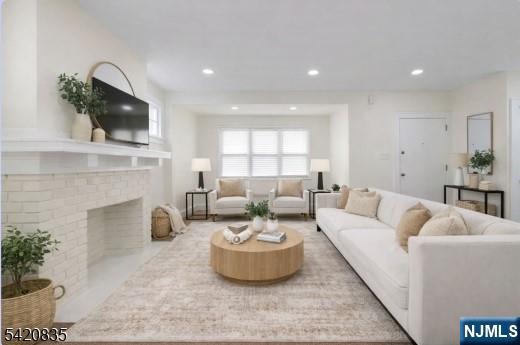39 Hurden Street Hillside, NJ 07205 - Photo 5 of 20 a living room with furniture and a fireplace