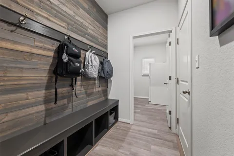 a view of hallway with wooden floor