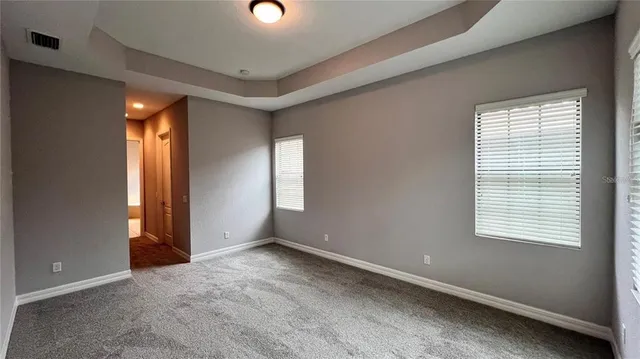 a kitchen with granite countertop a stove sink and cabinets