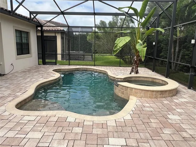 an aerial view of multiple houses with a yard