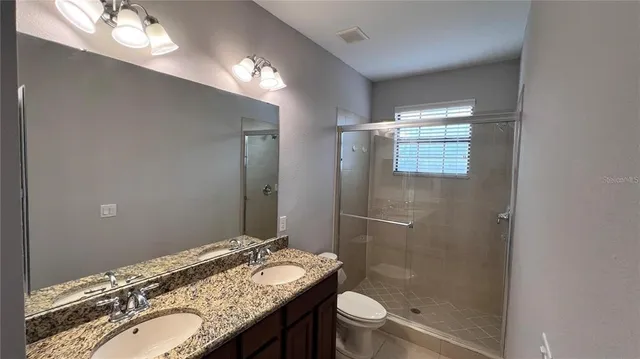 an aerial view of residential house with outdoor space