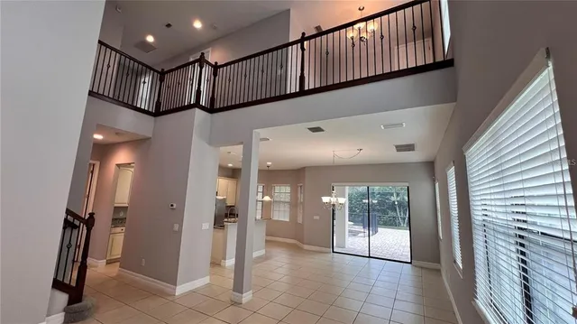 a kitchen with kitchen island cabinets and chairs in it