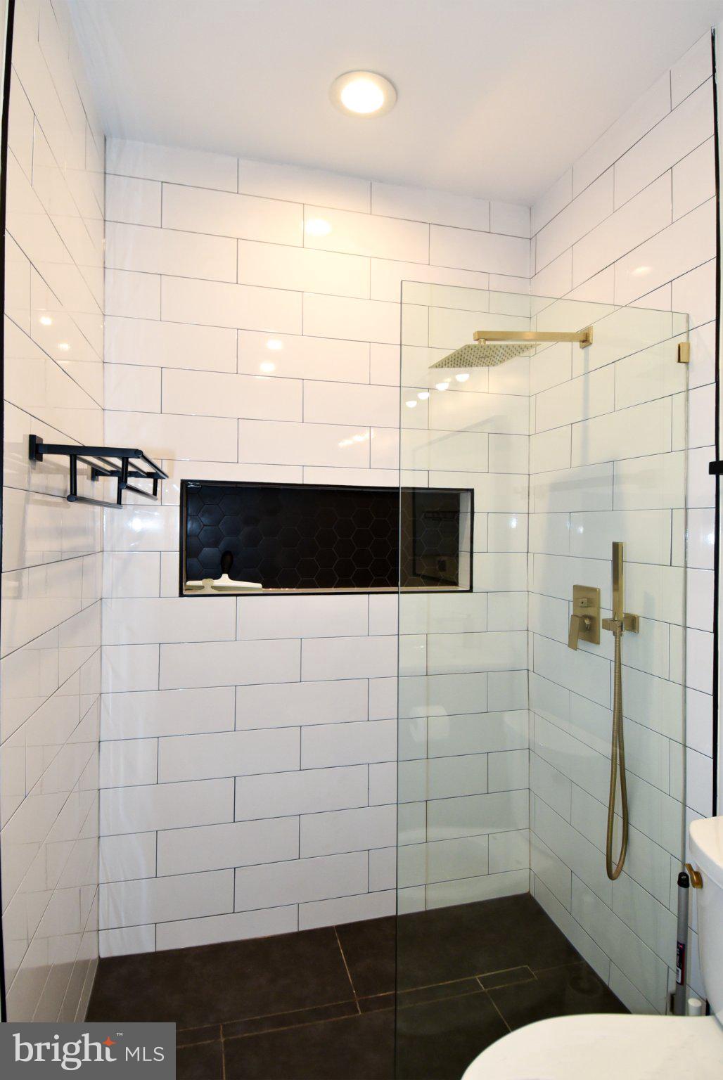 1316 9th Street Northwest Washington, DC 20001 - Photo 19 of 44 Sleek modern shower with elegant tiles.