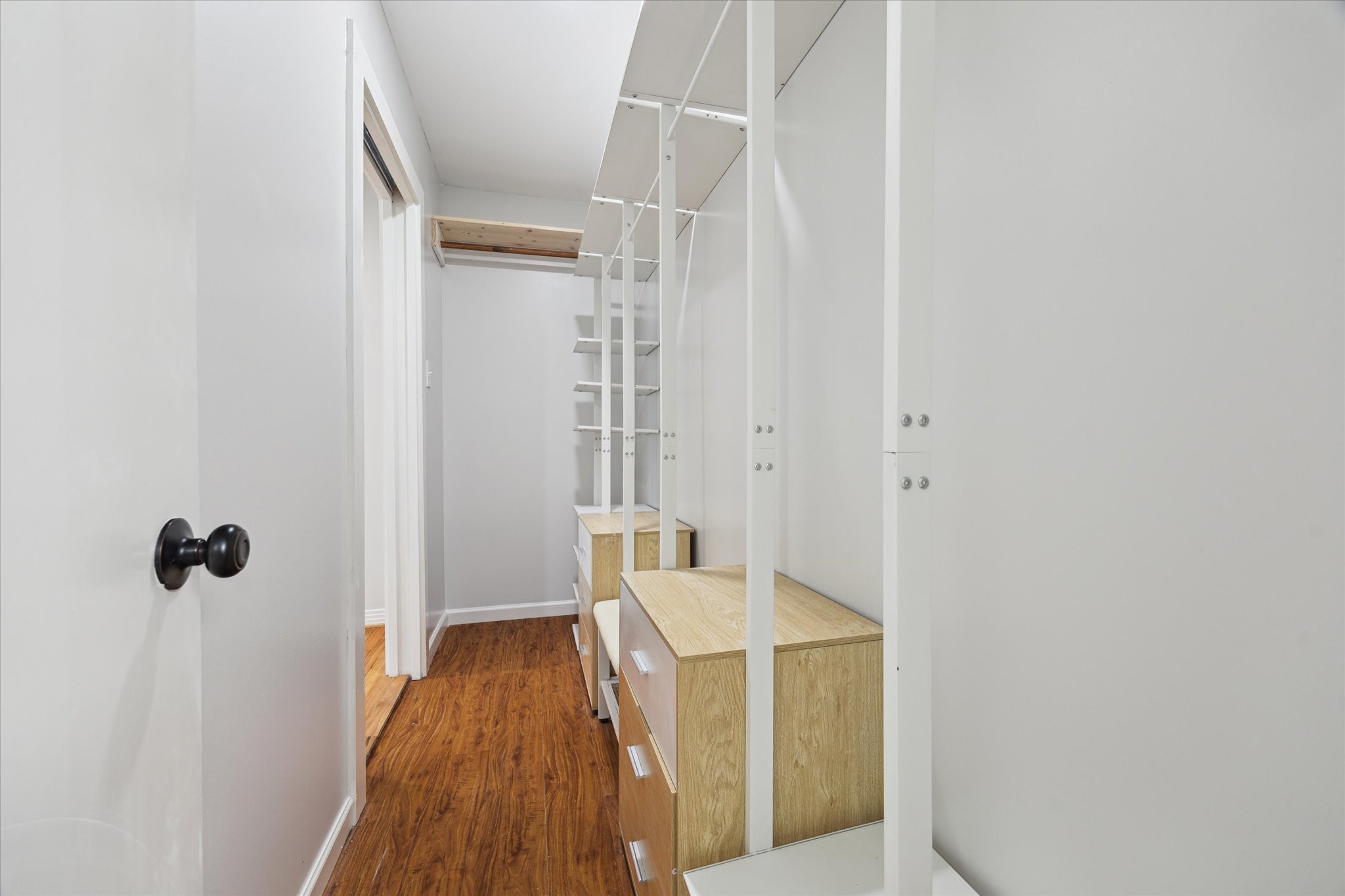 522 Barkley Street Houston, TX 77022 - Photo 9 of 18 This primary closet has been re-designed to provide incredible storage!