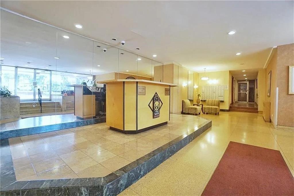 9801 Shore Road, Unit 2Q Brooklyn, NY 11209 - Photo 2 of 9 a view of a lobby with a couch and a view of living room