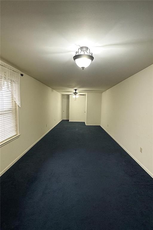 9801 Shore Road, Unit 2Q Brooklyn, NY 11209 - Photo 3 of 9 an empty room with a empty space and windows