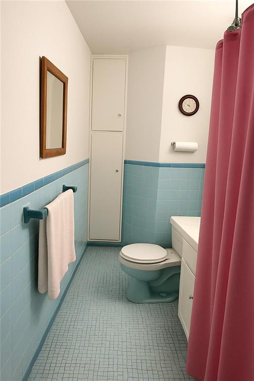 9801 Shore Road, Unit 2Q Brooklyn, NY 11209 - Photo 7 of 9 a bathroom with a toilet and a sink