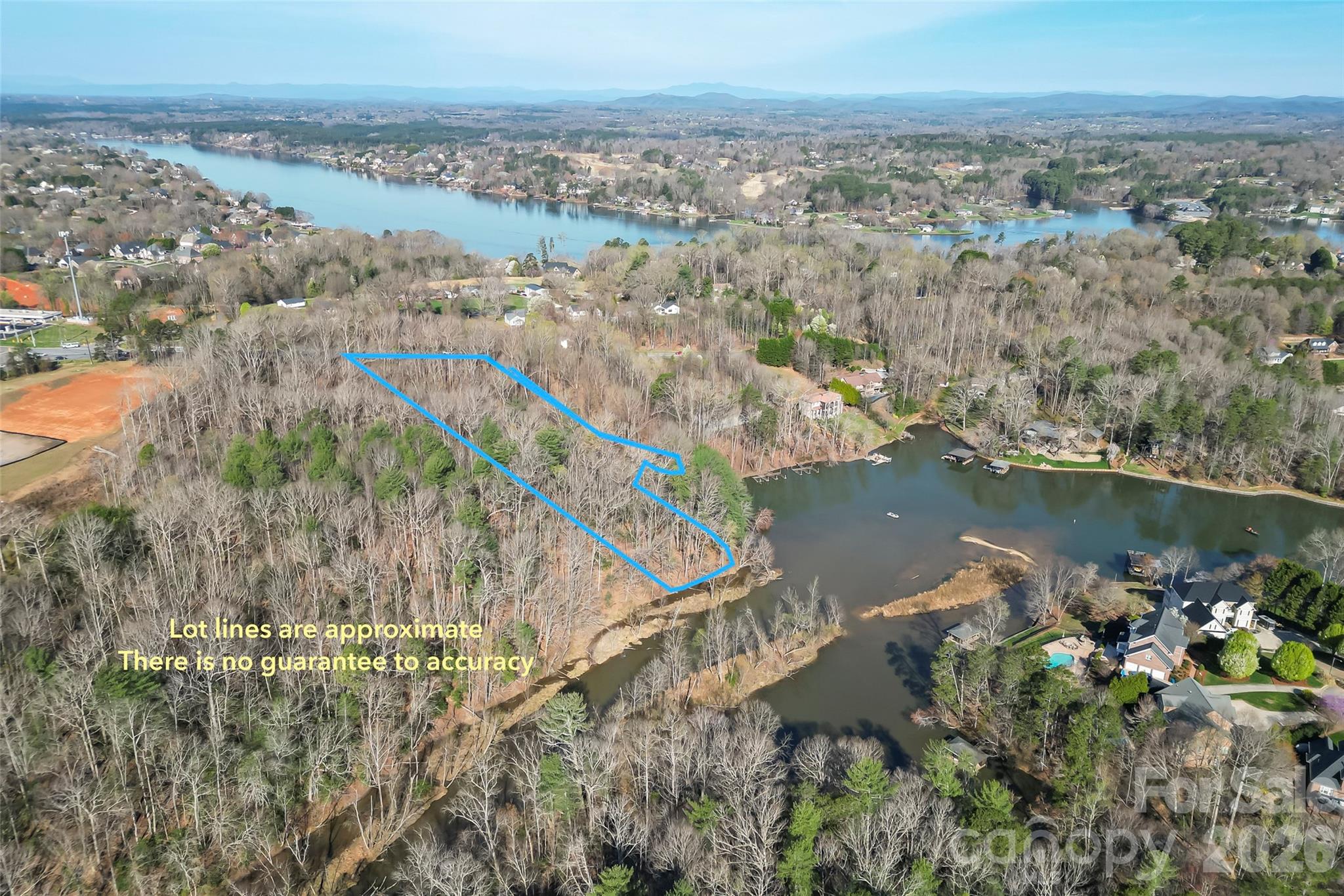 an aerial view of residential building and lake