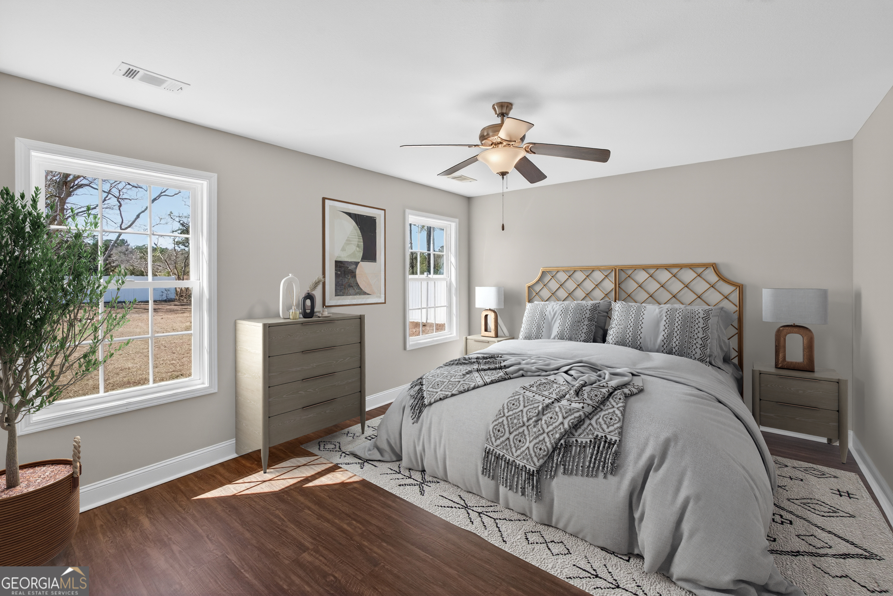303 Tallulah Bend Ellabell, GA 31308 - Photo 27 of 48 a bedroom with a bed and wooden floor