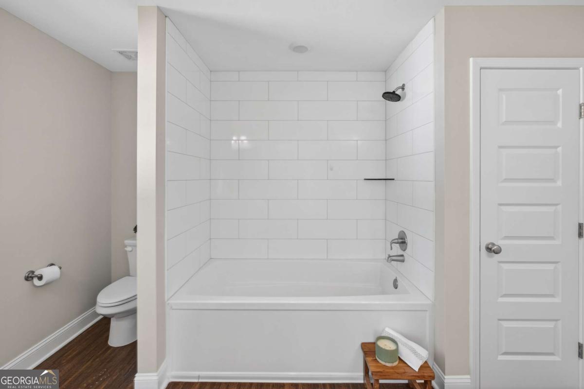 303 Tallulah Bend Ellabell, GA 31308 - Photo 30 of 48 a bathroom with a bathtub and a toilet