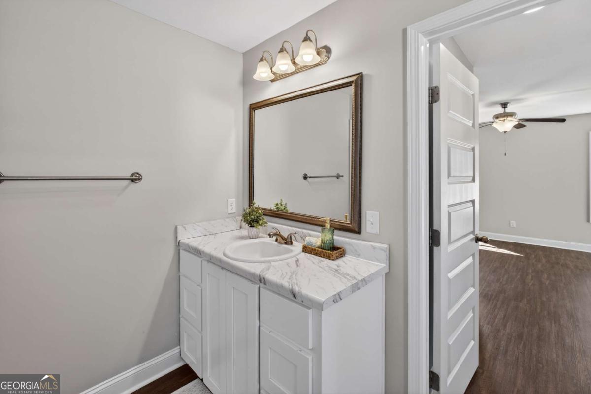 303 Tallulah Bend Ellabell, GA 31308 - Photo 32 of 48 a bathroom with a sink vanity and a mirror