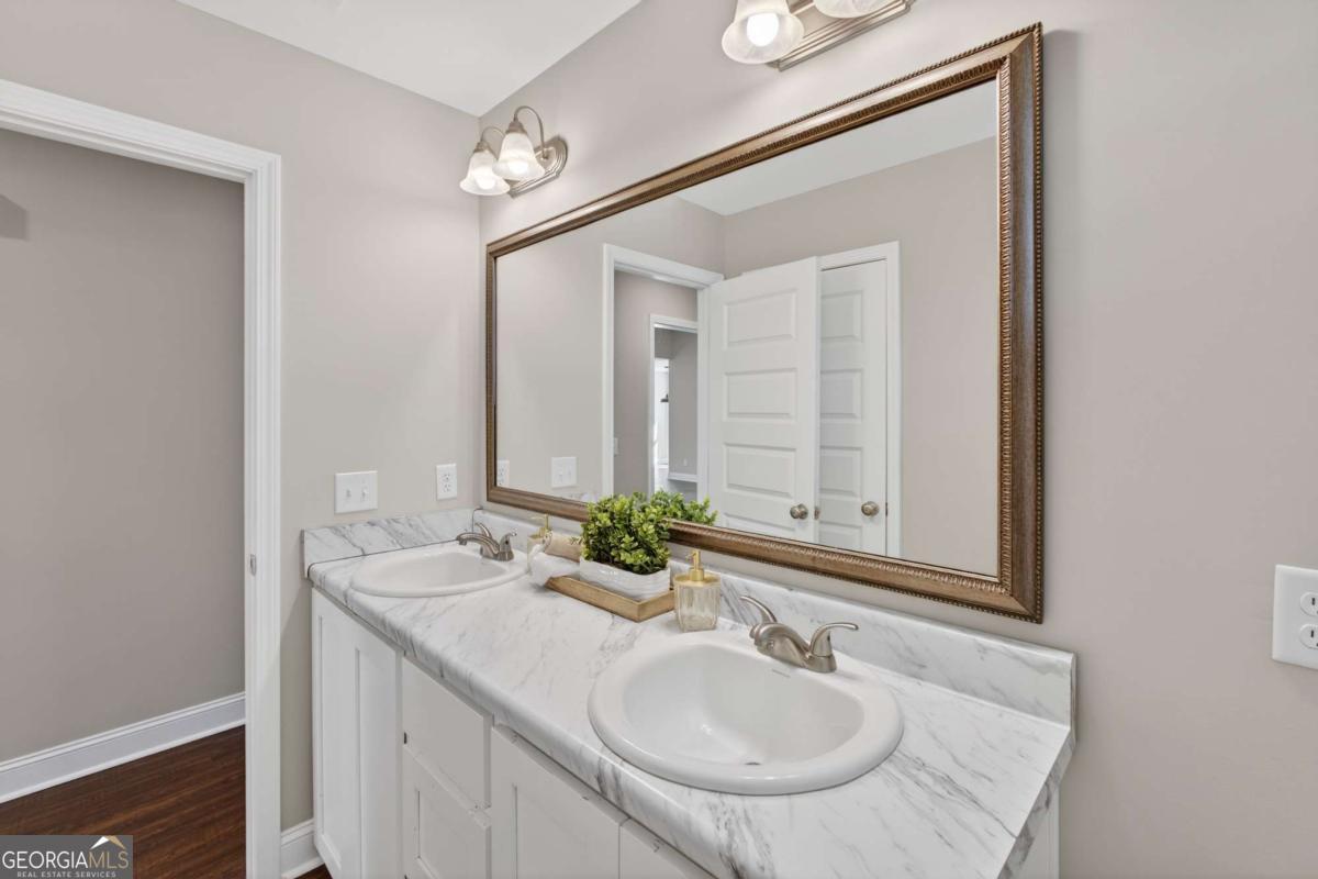 303 Tallulah Bend Ellabell, GA 31308 - Photo 38 of 48 a bathroom with a sink and a mirror