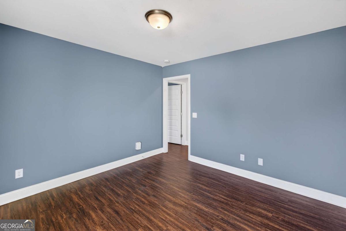 303 Tallulah Bend Ellabell, GA 31308 - Photo 40 of 48 a view of an empty room with wooden floor