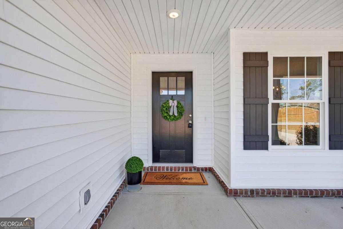 303 Tallulah Bend Ellabell, GA 31308 - Photo 4 of 48 a window with a glass door
