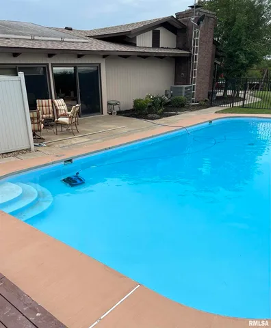 a view of balcony with wooden fence