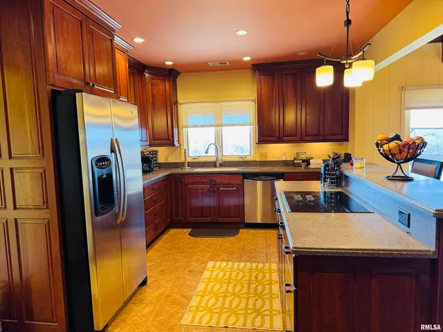 a view of a dining room with furniture and window