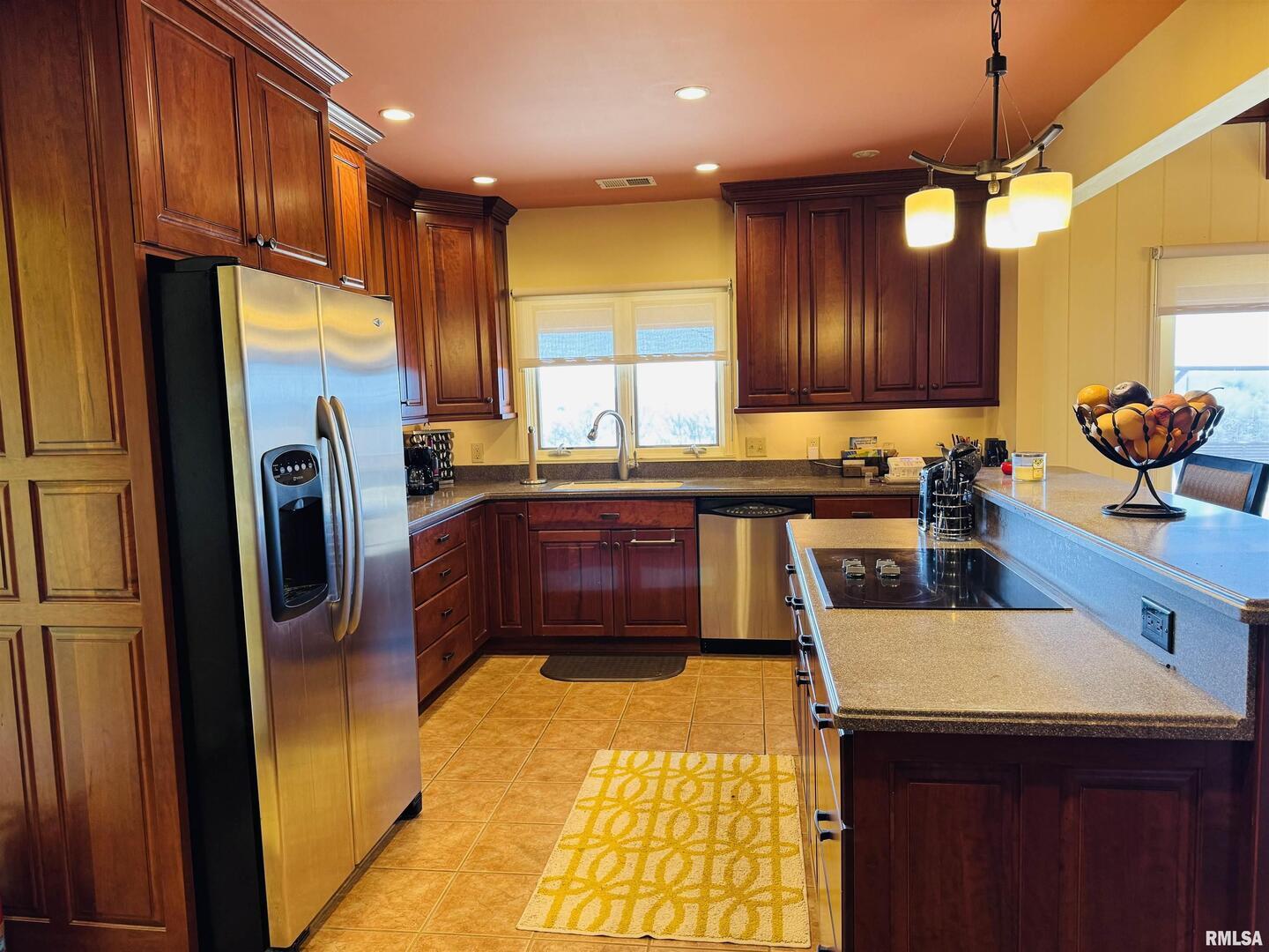 800 South Green Street Anna, IL 62906 - Photo 27 of 44 a kitchen with stainless steel appliances granite countertop a refrigerator a sink dishwasher and wooden cabinets with a dishwasher