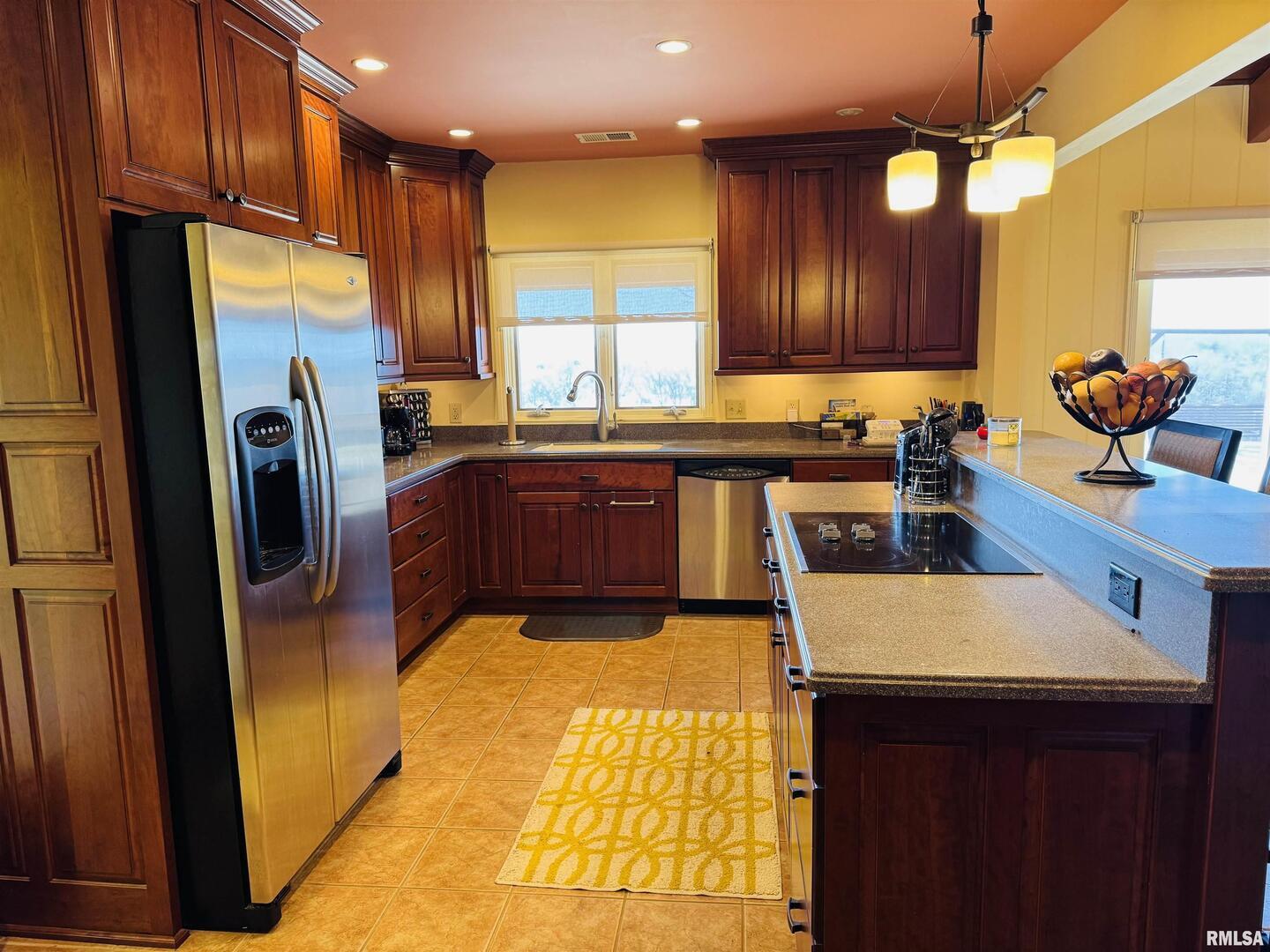 800 South Green Street Anna, IL 62906 - Photo 28 of 44 a kitchen with stainless steel appliances granite countertop a sink a stove and a refrigerator
