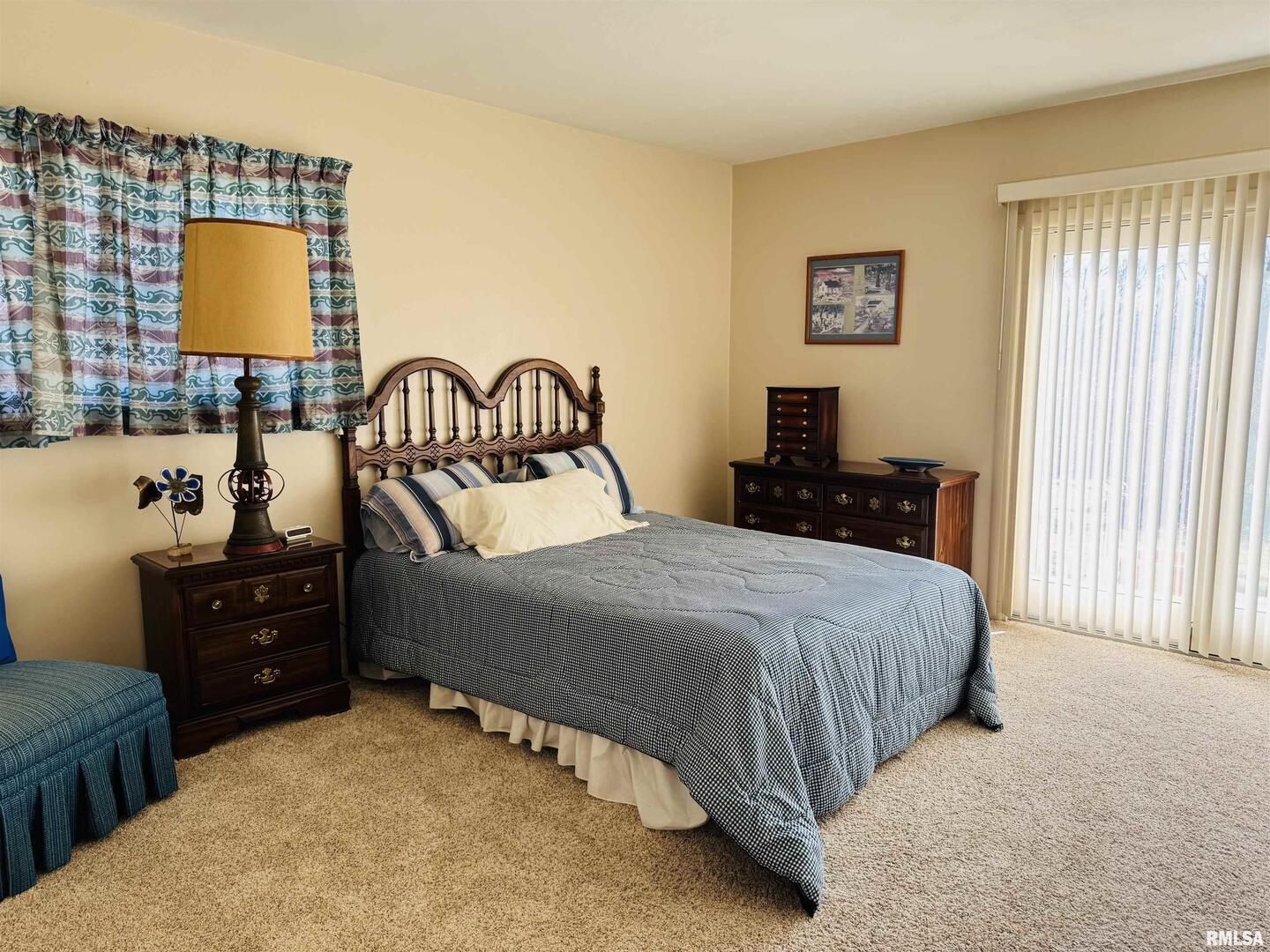 800 South Green Street Anna, IL 62906 - Photo 38 of 44 a bedroom with a bed and dresser with mirror