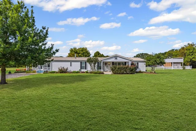 a view of a house with a big yard