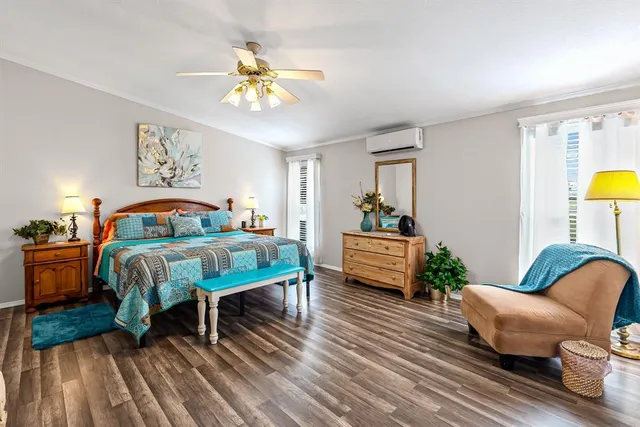 a bedroom with bed and a couch