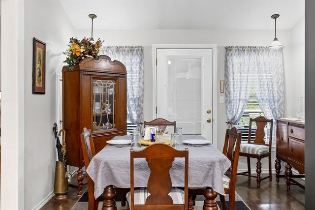 a dining room with furniture and window