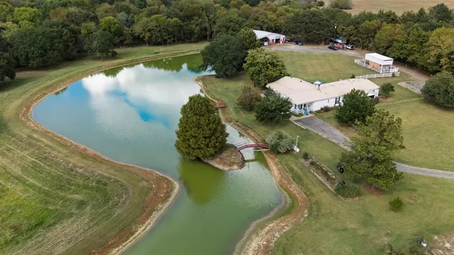 an aerial view of a house having yard