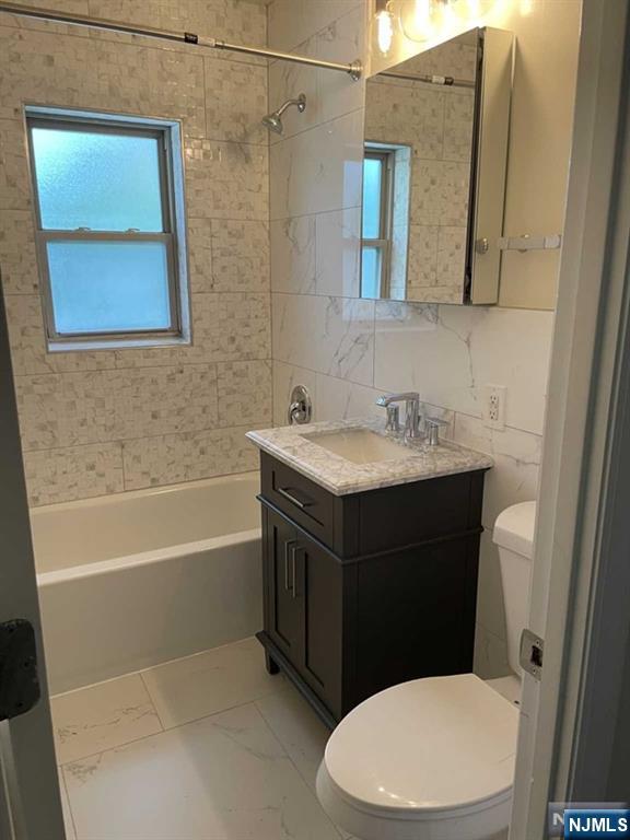 280-320 Oak Street, Unit 290D Ridgewood, NJ 07450 - Photo 9 of 20 a bathroom with a sink a toilet and shower