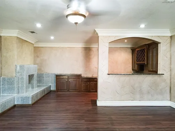 a view of hallway with furniture and wooden floor