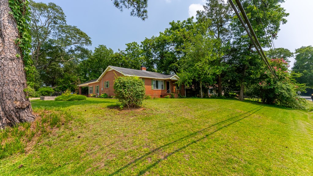 5352 Moon Road Columbus, GA 31909 - Photo 14 of 50 a backyard of a house with large trees and plants