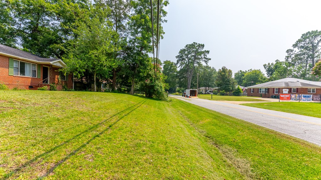 5352 Moon Road Columbus, GA 31909 - Photo 15 of 50 a view of swimming pool with lawn chairs and large trees