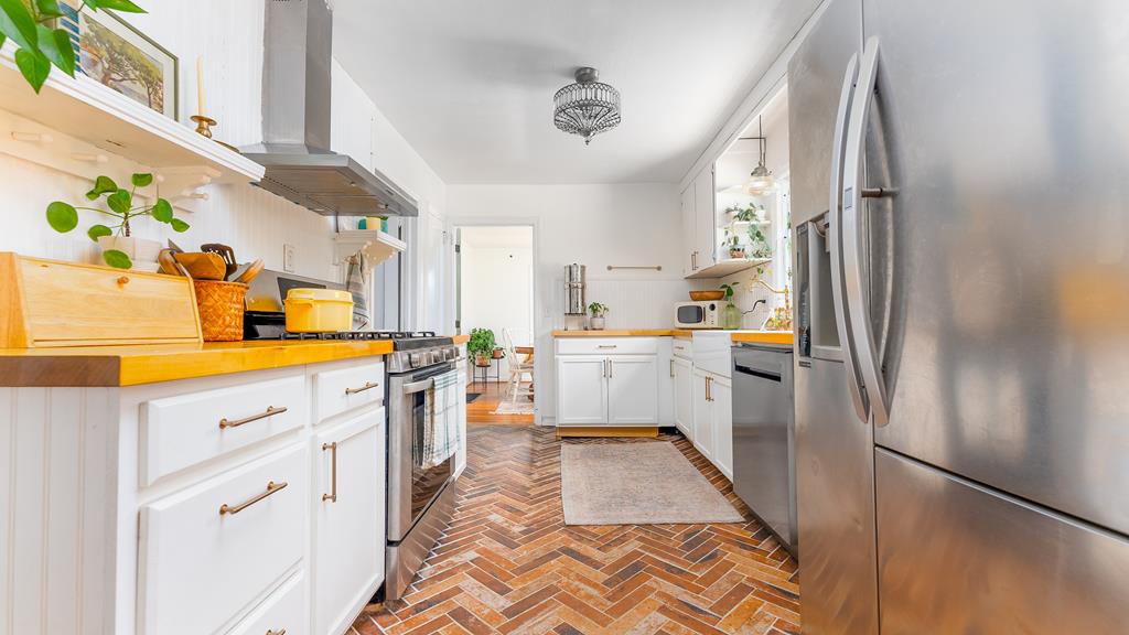 5352 Moon Road Columbus, GA 31909 - Photo 21 of 50 a kitchen with cabinets and stainless steel appliances