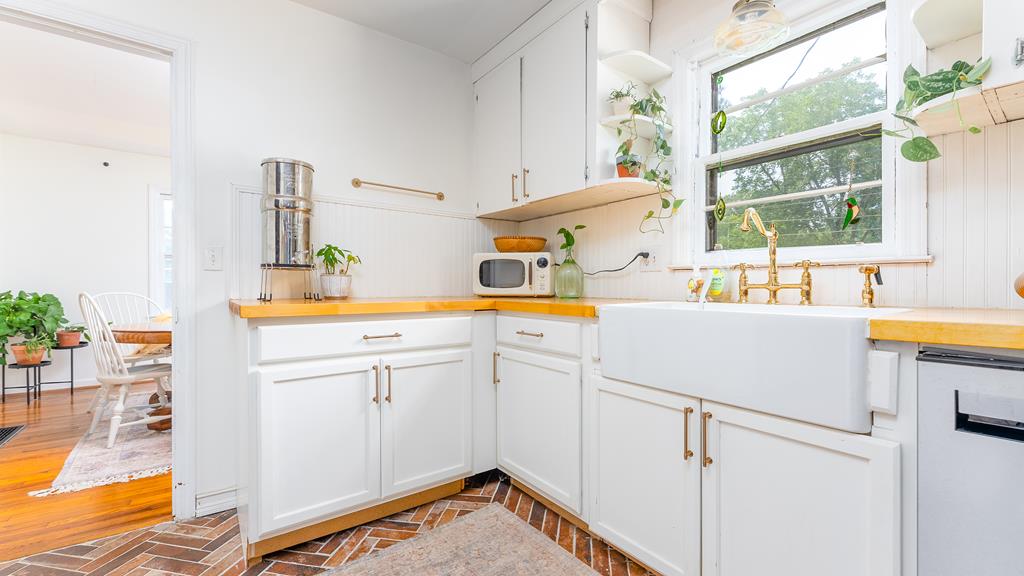 5352 Moon Road Columbus, GA 31909 - Photo 22 of 50 a utility room with cabinets washer and dryer