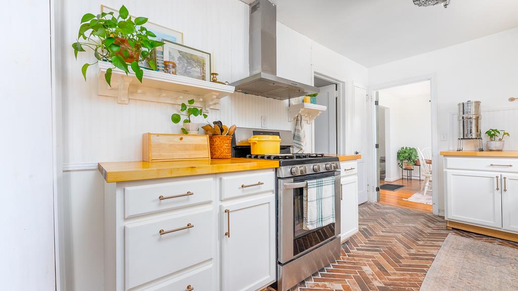 5352 Moon Road Columbus, GA 31909 - Photo 23 of 50 a kitchen with stainless steel appliances a white cabinets stove and a refrigerator