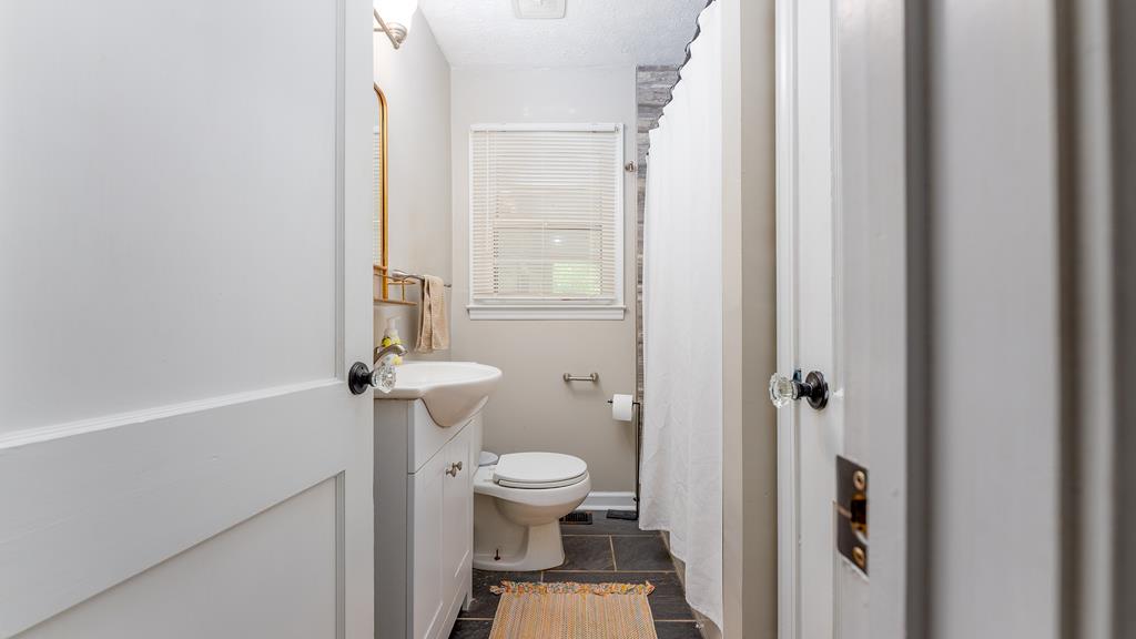 5352 Moon Road Columbus, GA 31909 - Photo 27 of 50 a bathroom with a toilet and a shower