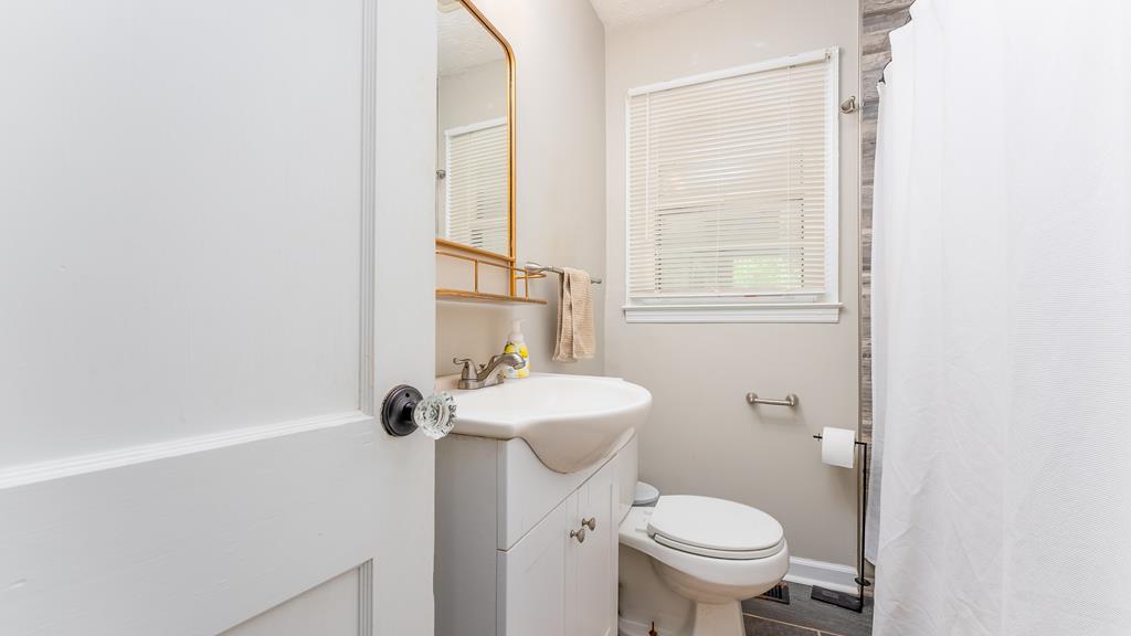 5352 Moon Road Columbus, GA 31909 - Photo 28 of 50 a bathroom with a sink toilet and a mirror