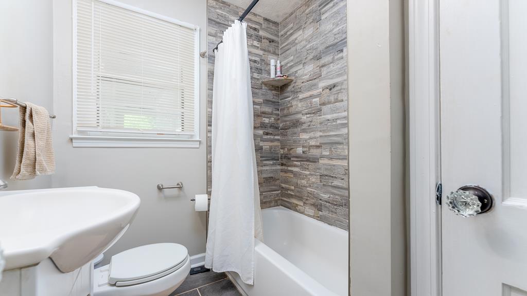 5352 Moon Road Columbus, GA 31909 - Photo 29 of 50 a bathroom with a toilet and a bathtub